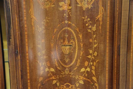 An Edwardian marquetry inlaid bowfronted china display cabinet, in the manner of Edwards & Roberts, H.6ft 6in. W.5ft 4in.